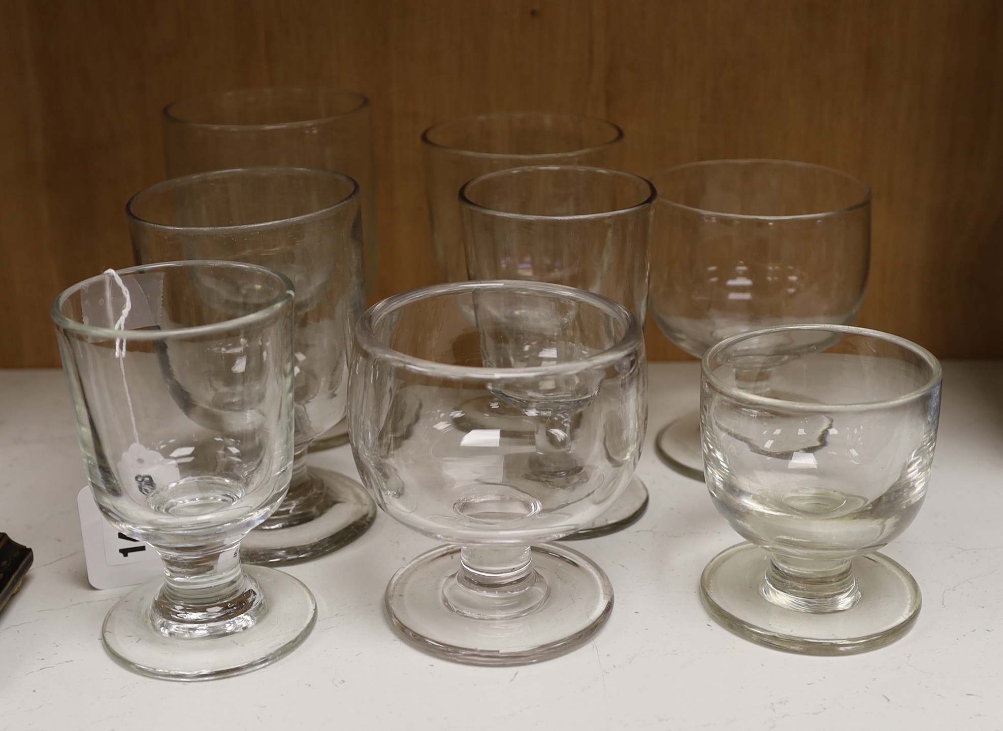 Eight varying sized glass rummers, tallest 15.5cm high